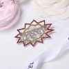 cc Brooch