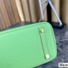 Her birkin new arrival bag green